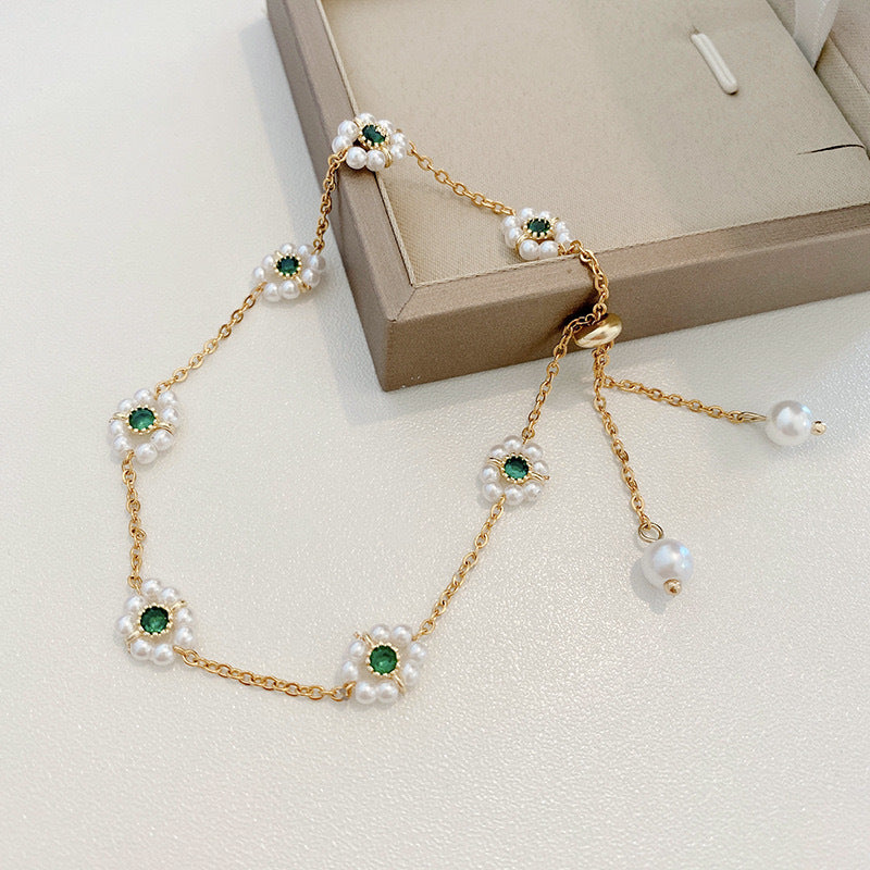 Dainty Pearl Daisy Bracelet | Adjustable Gold Chain with Green Gem Centre