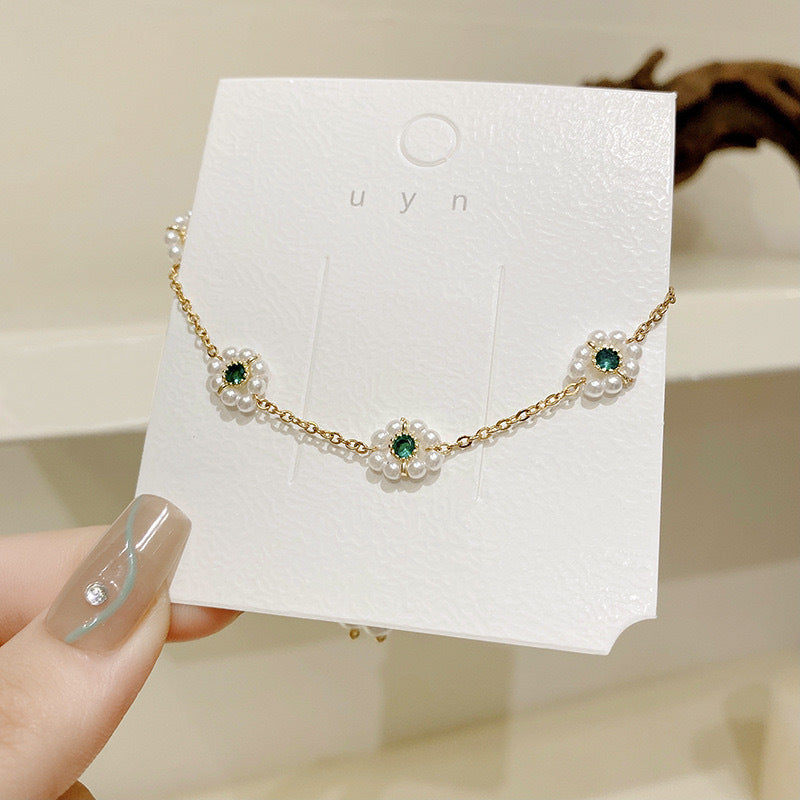 Dainty Pearl Daisy Bracelet | Adjustable Gold Chain with Green Gem Centre